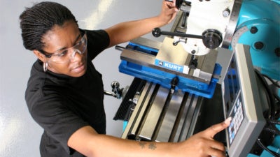 Apprentice working on an industrial machine