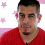 headshot of Gerardo Reyes Chavez wearing a red shirt