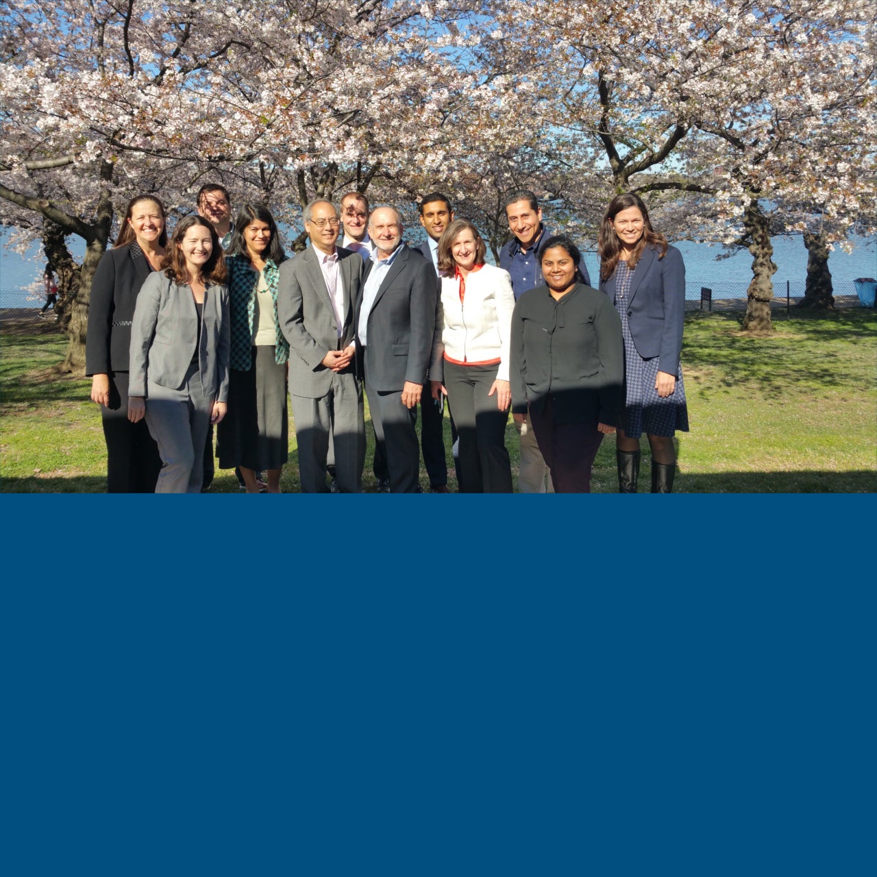 Group photo of individuals representing the member organizations of the Microfinance Impact Collaborative.