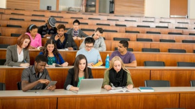A group of students in a university classroom