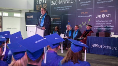 JetBlue's Chief Executive Officer and President, Robin Hayes congratulates the first graduates of JetBlue's employer-sponsored college degree program - JetBlue Scholars. (Photo: Business Wire)