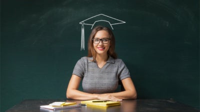 Young woman with graduation hat