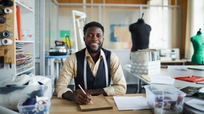 Tailor working in his shop
