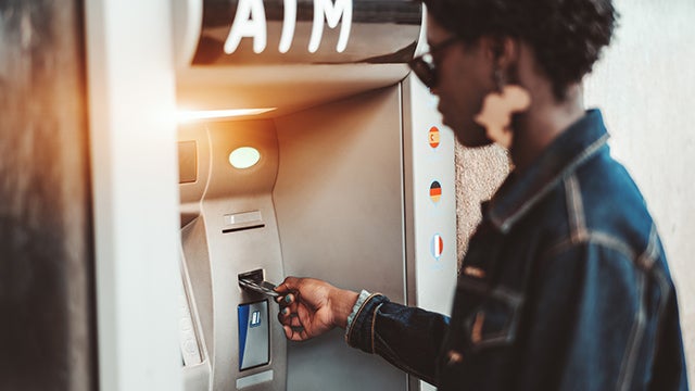 Woman using ATM