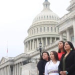 Indigenous youth on the steps of the Capitol