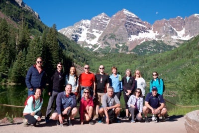 Colleague Savilla Pitt (back row, far right) on a morning hike with the Aspen Cybersecurity Group, Maroon Bells in Aspen, summer 2019
