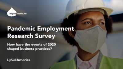 Foreground: "Pandemic Employment Research Survey: How have the events of 2020 shaped business practices?" Background: Photo of a Black woman worker wearing a hard hat, reflector vest, and face mask.
