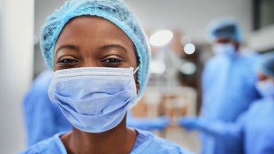 Photo of a smiling nurse in an operating room