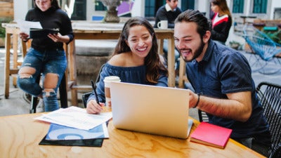 Latino students working on a laptop