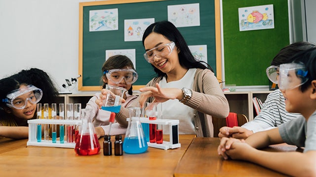 Teacher and students in science class