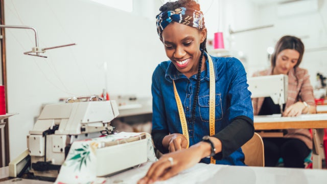 Photo of a woman working at a sewing machine