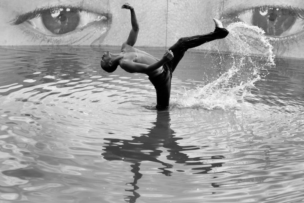 Charles “Lil’ Buck” Riley performs a special dance piece in a pond at Anderson Park during the Aspen Ideas Festival 2015
