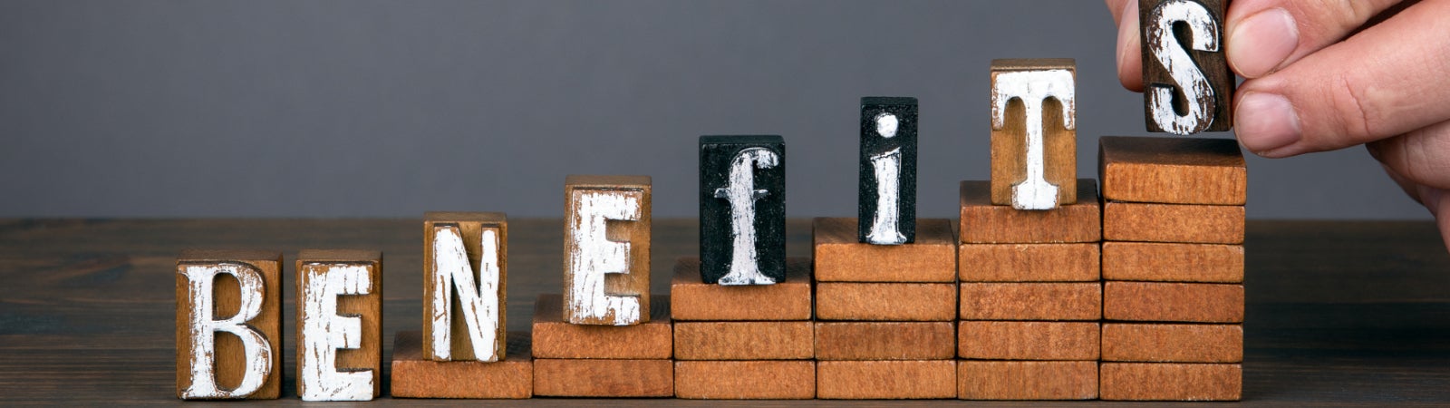 Photo of ascending wooden blocks that spell out the word "Benefits"