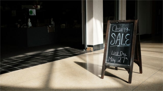 A "closing sale" sign stands outside one of the last few open stores at the Schuylkill Mall in Frackville, Pennsylvania. The mall closed in 2018.