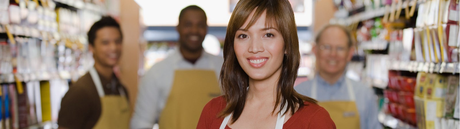 Group of smiling retail workers