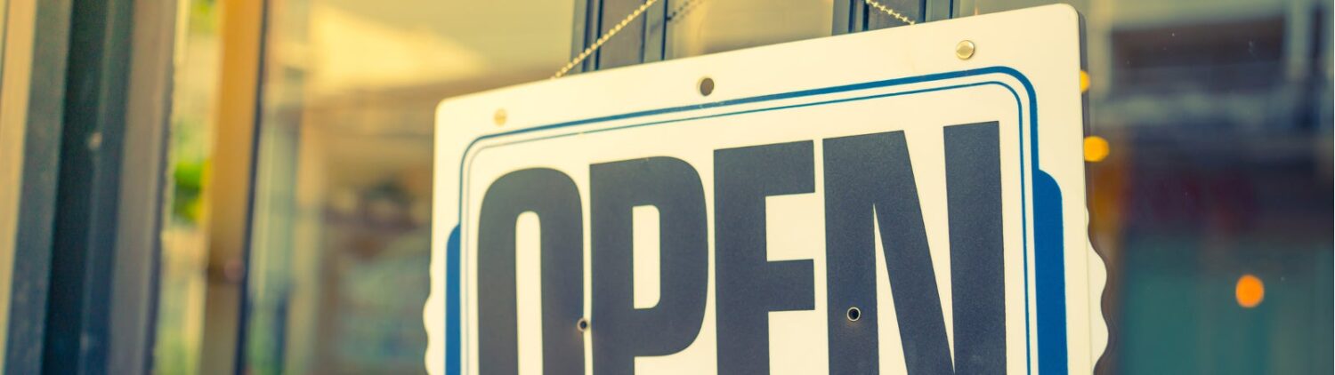 Open sign on a glass door