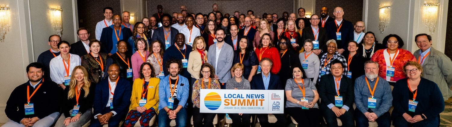 A group photo of attendees at the Local News Summit.