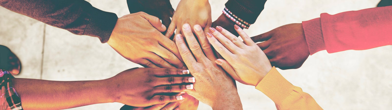Aerial view of supported hands out together