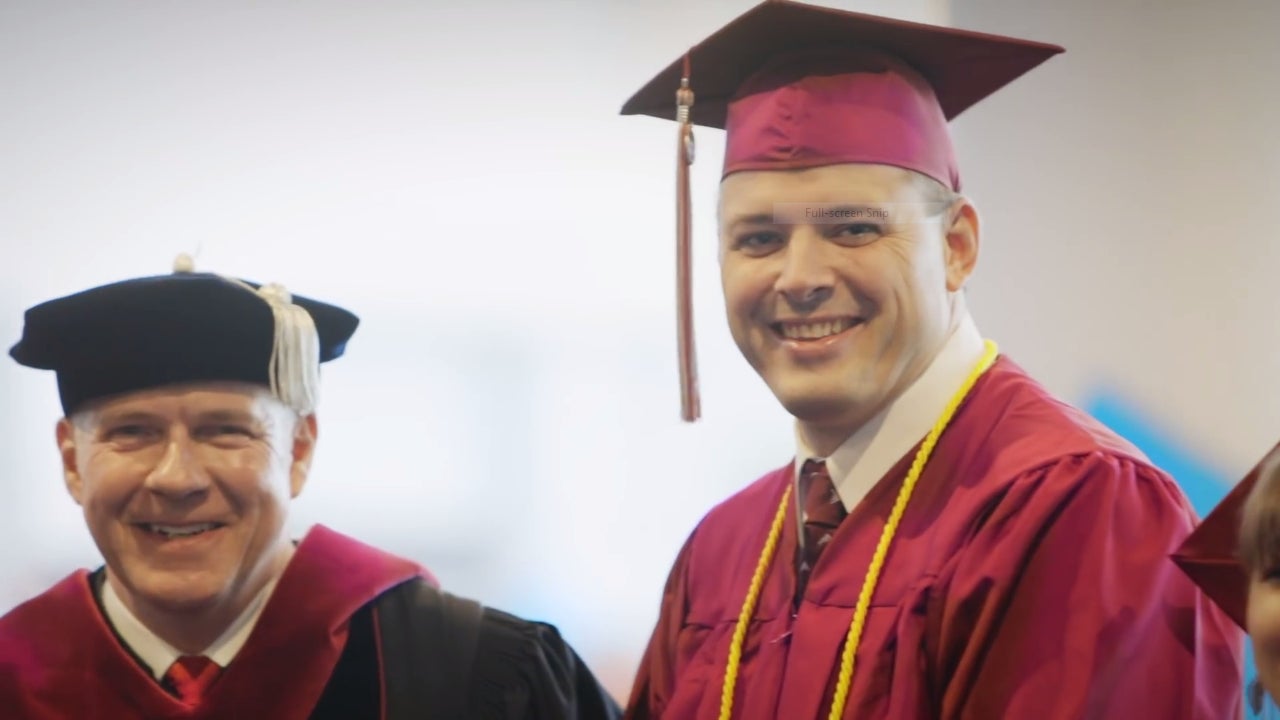 Student and professor in graduation attire