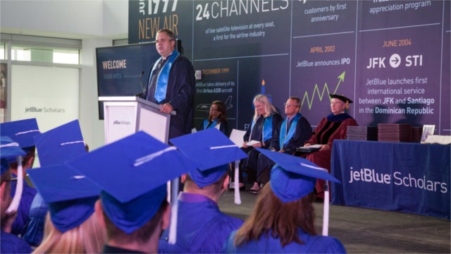 JetBlue's Chief Executive Officer and President, Robin Hayes congratulates the first graduates of JetBlue's employer-sponsored college degree program - JetBlue Scholars. (Photo: Business Wire)