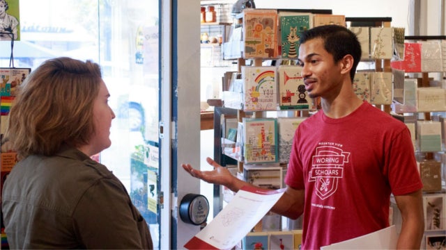 Two people discussing the Mountain View Working Scholars Program.