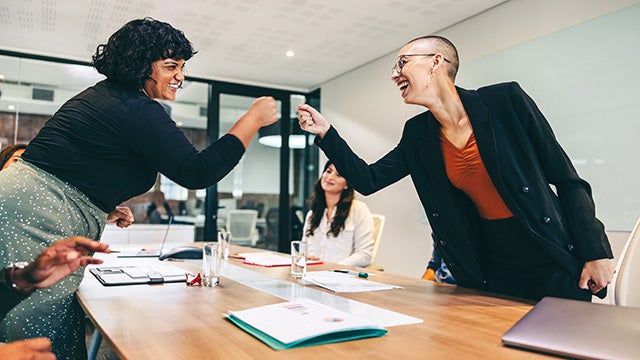 Businesspeople fist bumping