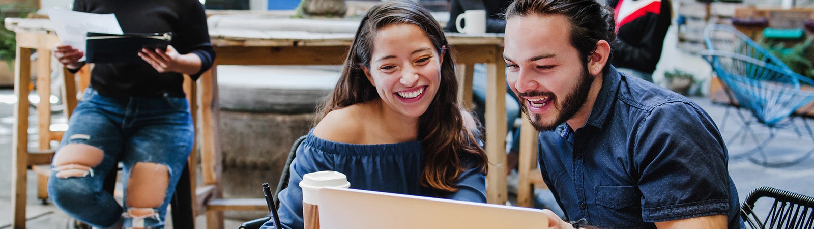 Latino students working on a laptop