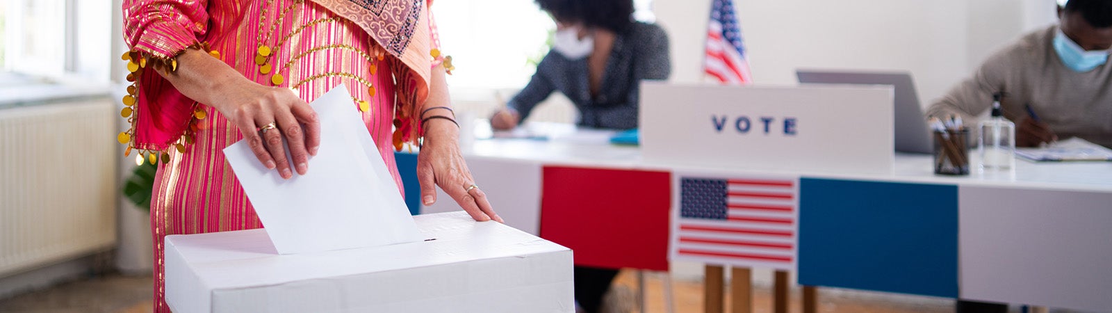 Muslim woman voting in election