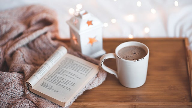 open book with hot chocolate