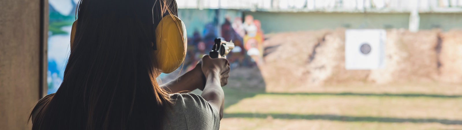 Woman practices shooting target
