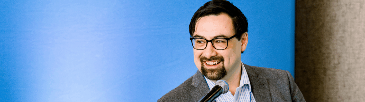 Tim Shaw speaks at a podium