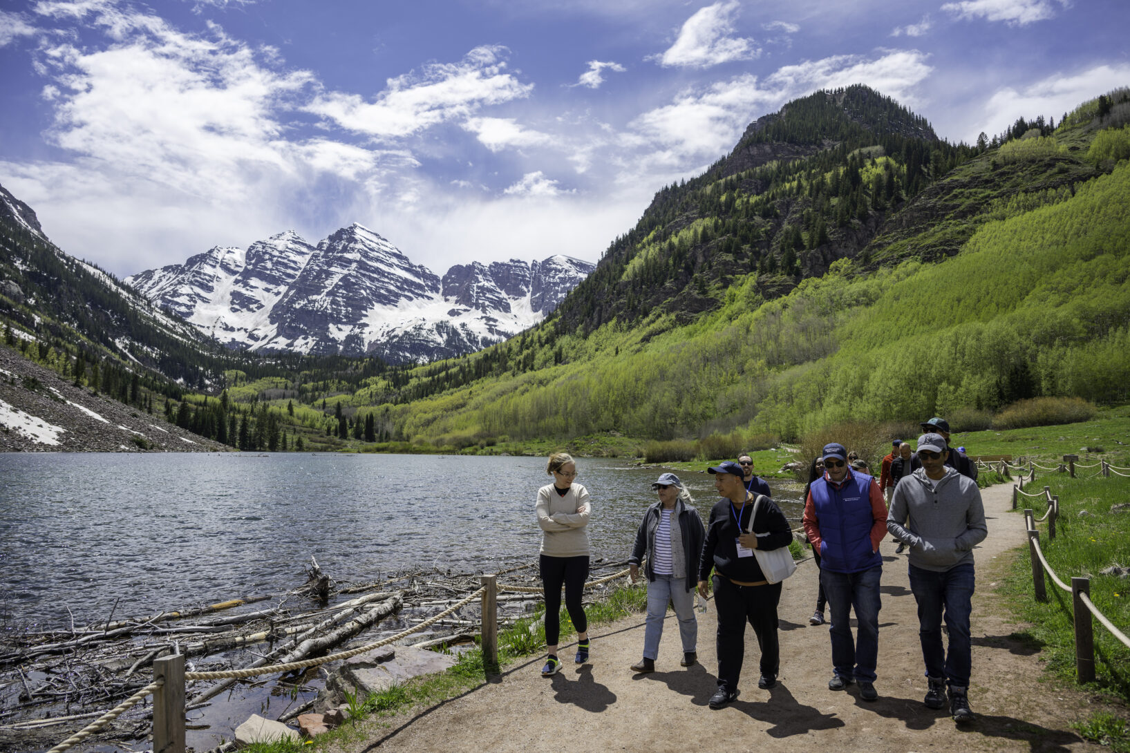 Seminar participants hiking with the Maroon Bells mountain peaks in the background.