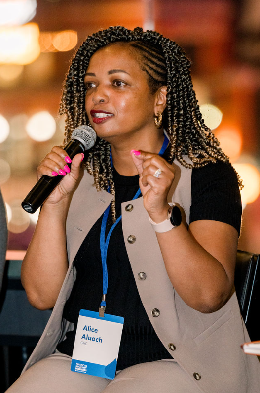 Alice Aluoch speaks at an event.