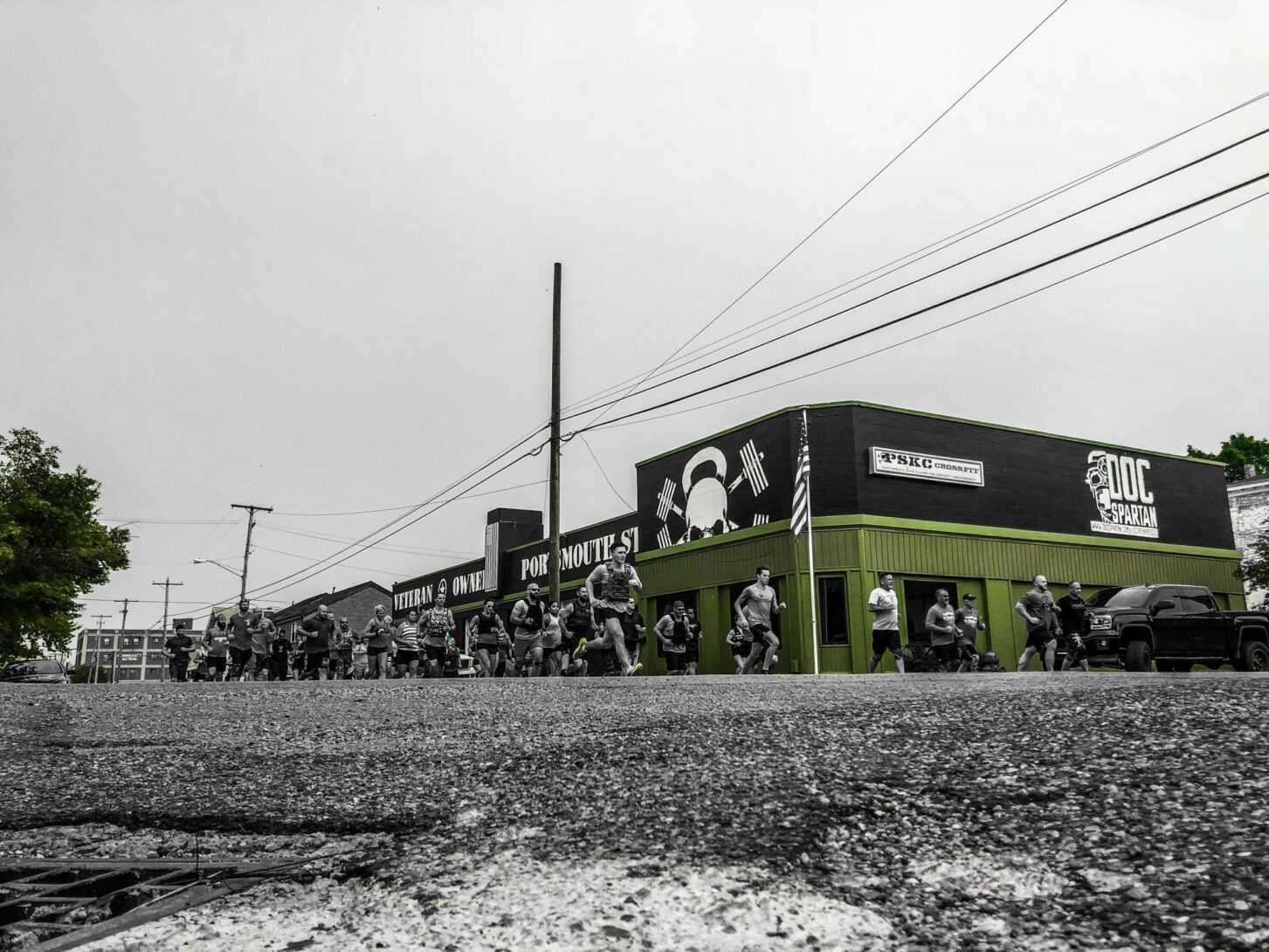 Neighbors enjoying a community meal and shaking hands. Photo credit: Andy Clayton-King