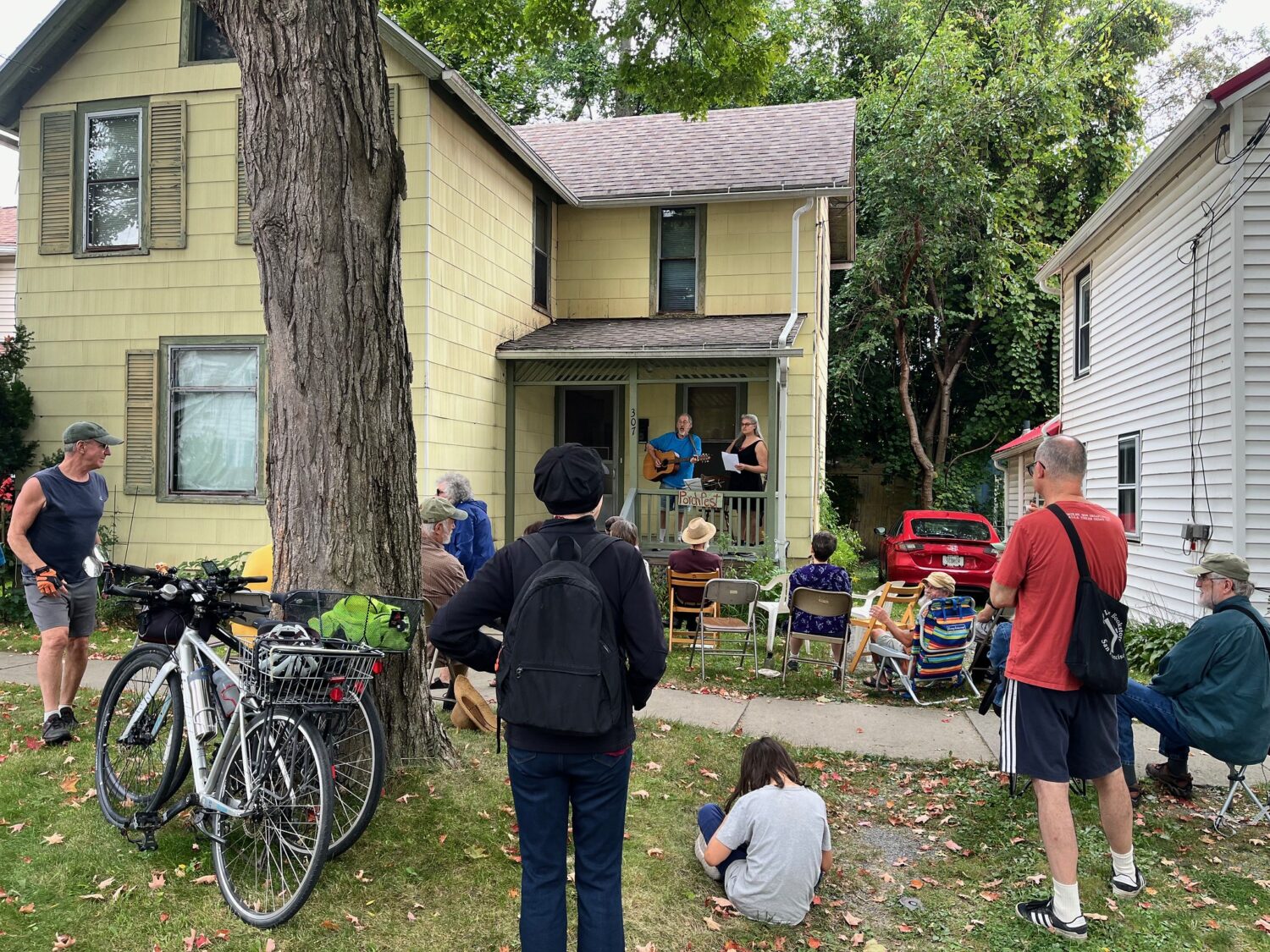 Neighbors gather to hear live music during Ithaca Porchfest. Photo credit: Lesley Greene